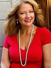 Awesome looking older dame is covered with jizz