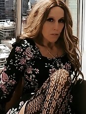 A passionate woman in her prime strips her revealing dress.